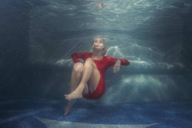 istock Woman dives under the water. 672016960
