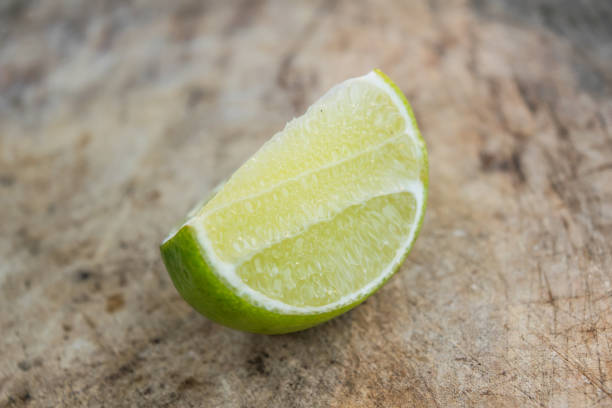 istock selective focus lime slices on a wooden cutting board 672022768