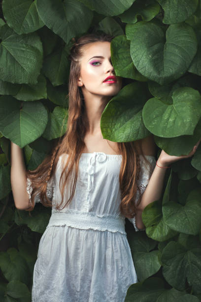 istock Woman with green eyes among nature. 672023046