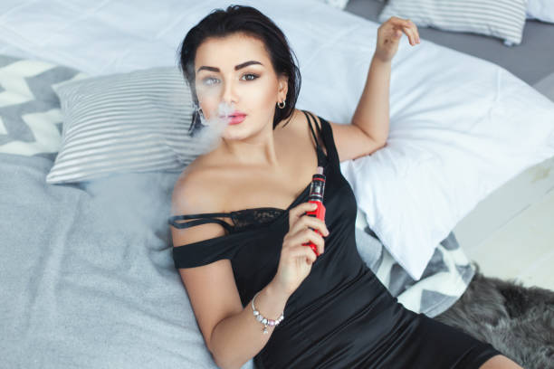 istock Woman sexy smokes. 672023056