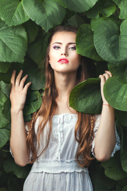 istock Gentle woman among nature. 672023082