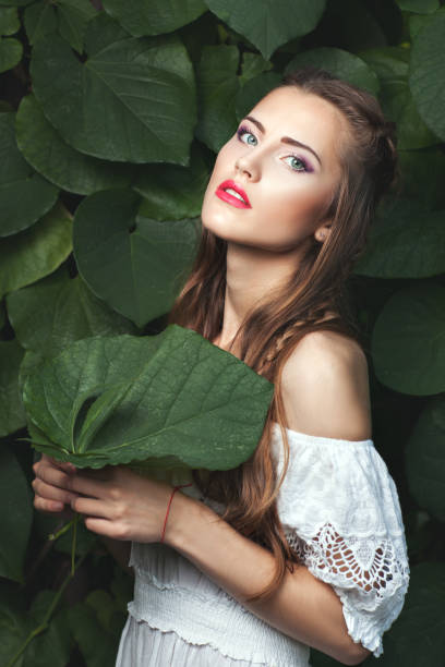istock Woman with a green leaf. 672023142