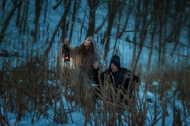 istock Girl and the dwarf death go through  woods. 672023146