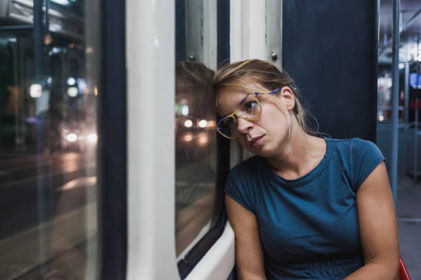 istock Young woman riding a public bus 672029282