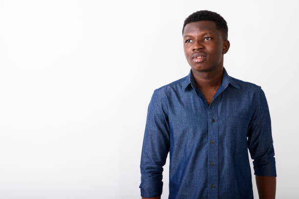 istock Studio shot of young black African man thinking while looking up against white background 672030670