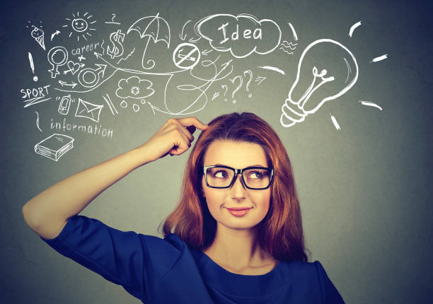 istock Portrait happy young woman thinking dreaming has many ideas looking at plan 672033886
