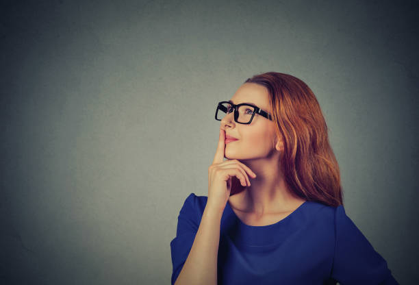 istock side profile happy beautiful woman thinking looking up 672033906