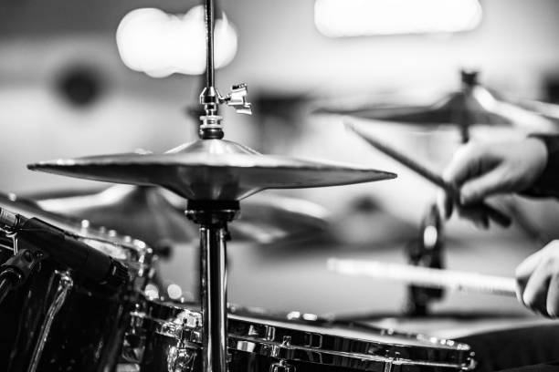 istock Drummer playing drums with hihat in the foreground 672039464