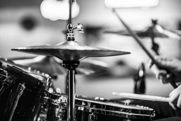 istock Drummer playing snare drum with hihat in the foreground 672039544