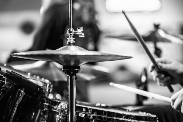 istock Drummer playing drums with hihat in the foreground 672039590