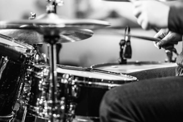 istock Drummer playing drums with hihat in the foreground 672039654