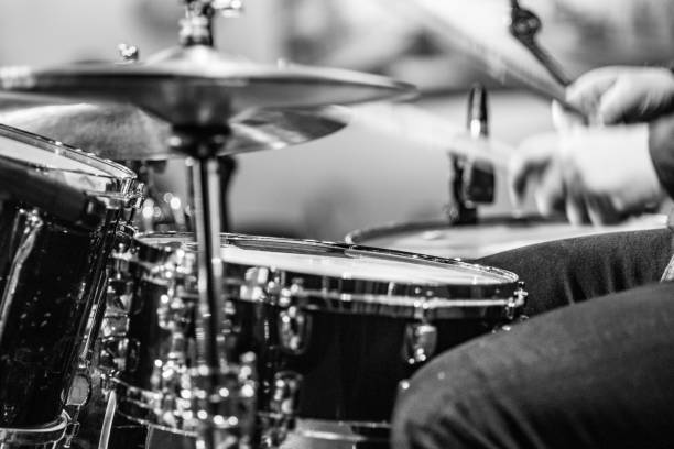 istock Drummer playing snare drum with hihat in the foreground 672039702