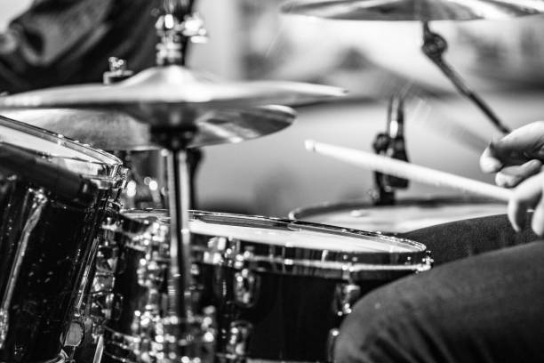 istock Drummer playing snare drum with hihat in the foreground 672039704