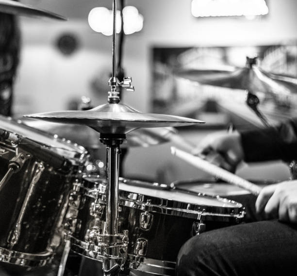 istock Drummer playing snare drum with hihat in the foreground 672039812