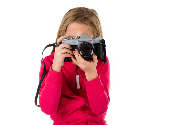 istock Girl with vintage camera isolated on white background 672039954