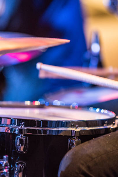 istock Drummer playing drums with hihat in the foreground 672040214