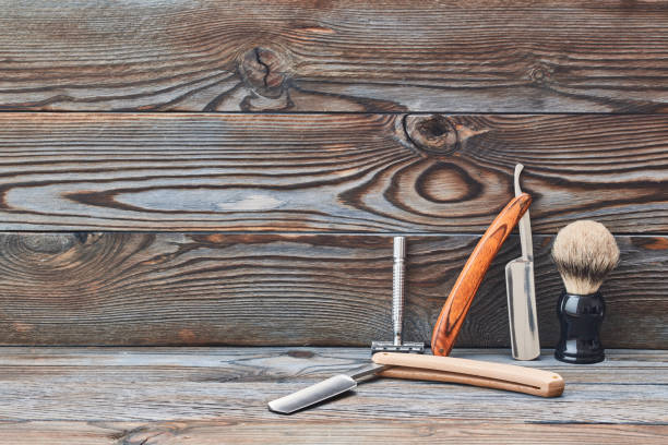 istock Vintage barber shop tools on wooden background 672040700