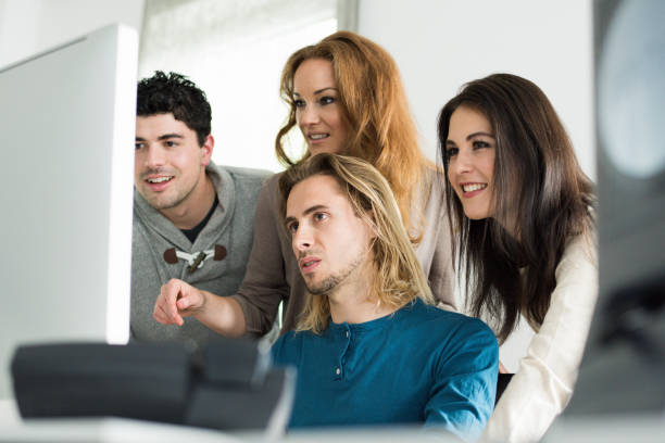 istock Business Team together at computer in modern workplace 672042974