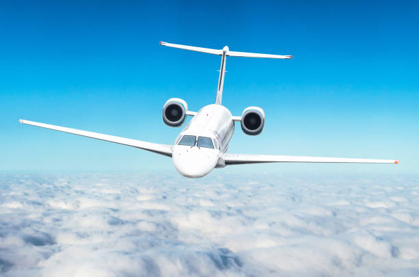 istock Airplane on flight level above the clouds in the blue sky 672046790