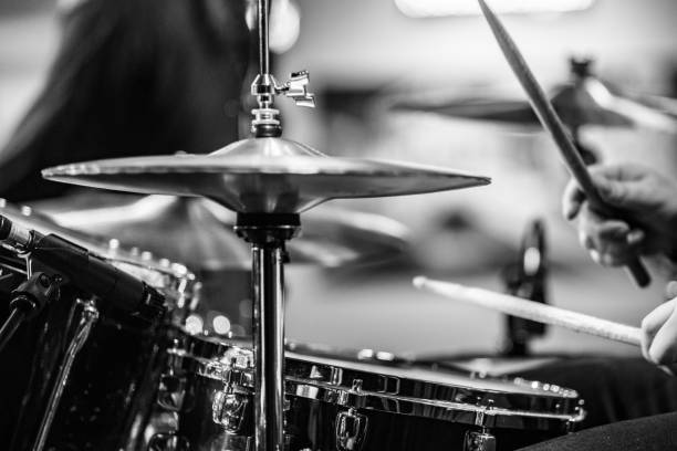 istock Drummer playing snare drum with hihat in the foreground 672056844