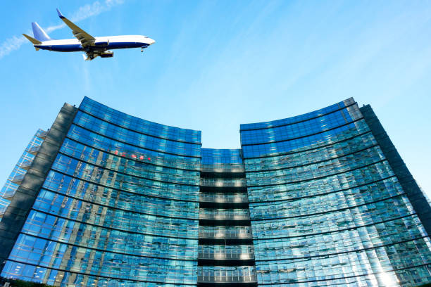 istock Airplane flying over modern Buildings in Milan, Italy 672061154