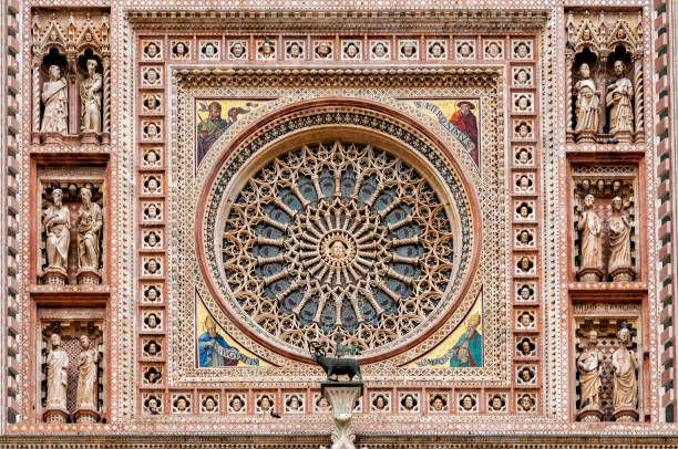 The Orvieto Cathedral central rose window. This cathedral is a 14th-century Roman Catholic cathedral dedicated to the Assumption of the Virgin Mary and situated in the town of Orvieto in Umbria, Italy