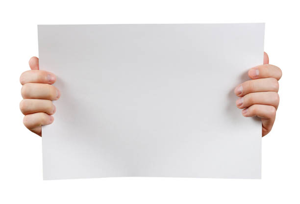 istock Close up. Human hands holding blank advertising card. Isolated on white background 672064528