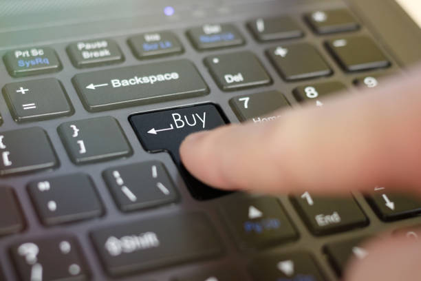 istock Finger clicks on the keyboard Buy. Closeup 672064582