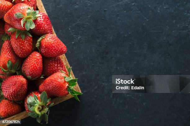 Top View Of A Wooden Box With Ripe Fresh Strawberries On A Black Table Place For The Text Healthy Food Concept Stock Photo - Download Image Now