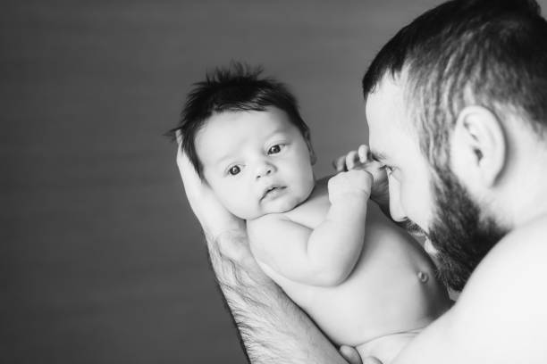 istock Happy father holding a baby boy 672070998