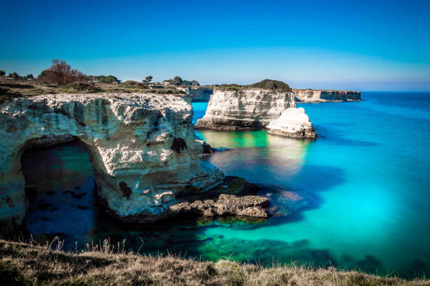 istock View of cliffs against waterscape in Sant'Andrea, Salento 672073632