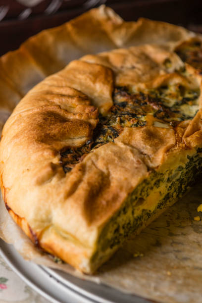 istock Baked salty pie with eggs, ricotta cheese and vegetables. 672080954