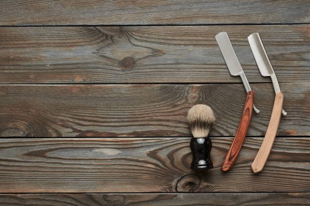 istock Vintage barber shop tools on wooden background 672085348