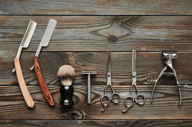 istock Vintage barber shop tools on wooden background 672085350