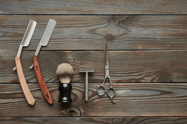 istock Vintage barber shop tools on wooden background 672085352
