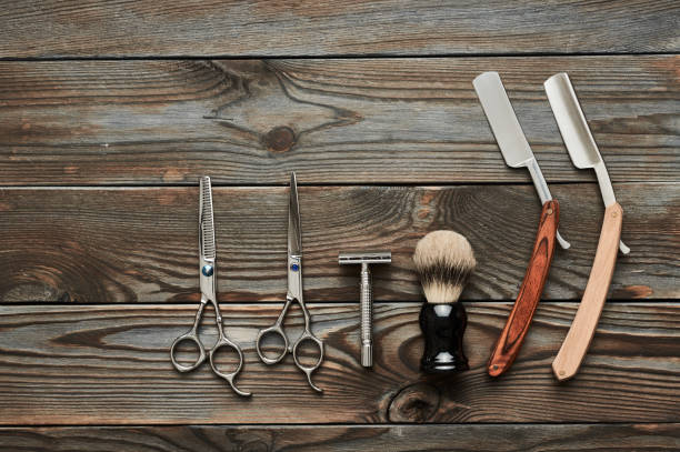 istock Vintage barber shop tools on wooden background 672085362
