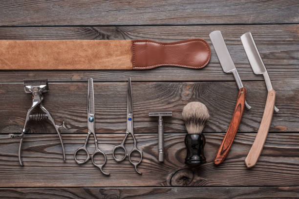 istock Vintage barber shop tools on wooden background 672085364