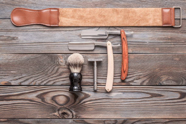 istock Vintage barber shop tools on wooden background 672085986