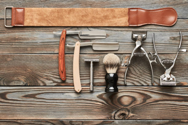 Vintage barber shop tools on wooden background