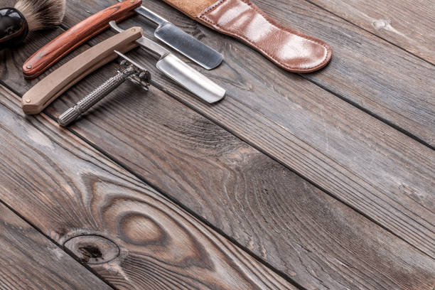 istock Vintage barber shop tools on wooden background 672087428