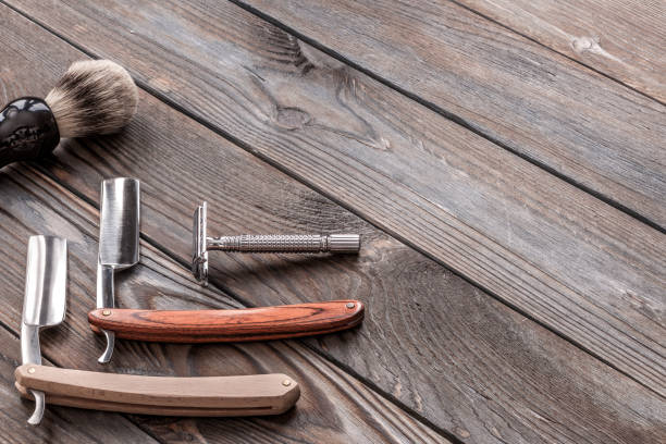 istock Vintage barber shop tools on wooden background 672087440
