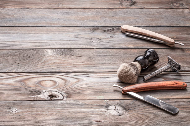 istock Vintage barber shop tools on wooden background 672089010