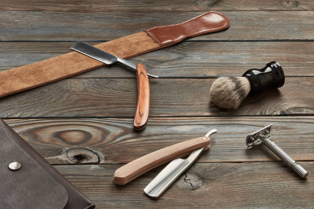 istock Vintage barber shop tools on wooden background 672089520