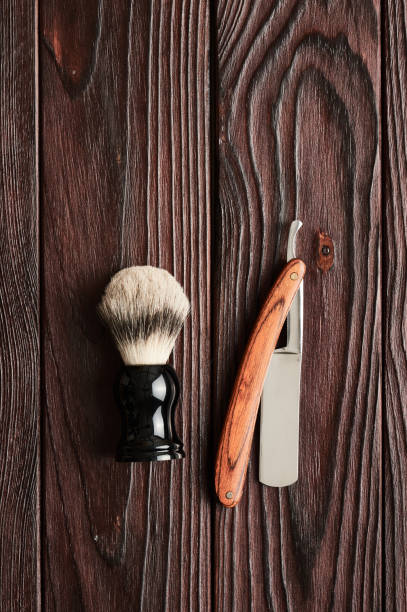 istock Vintage barber shop tools on wooden background 672089540
