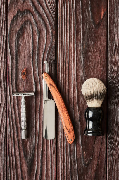 istock Vintage barber shop tools on wooden background 672089556