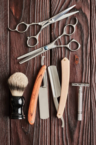 istock Vintage barber shop tools on wooden background 672089562