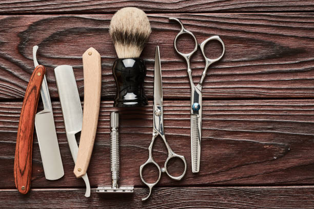 istock Vintage barber shop tools on wooden background 672089566