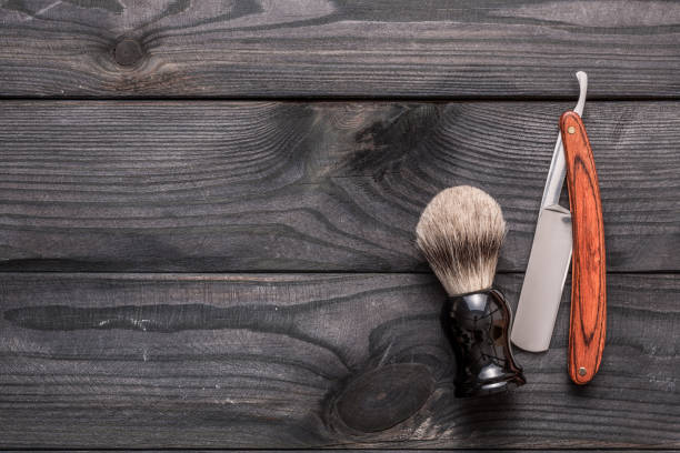 istock Vintage barber shop tools on wooden background 672089630