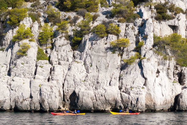 Two kayaks in front of the steep cliffs in the Calanques of Cassis (Provence, France) stock photo