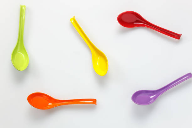 istock Top view colorful plastic spoon on white table background with copy space. 672090450